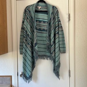 Blue cardigan with tassel fringe.